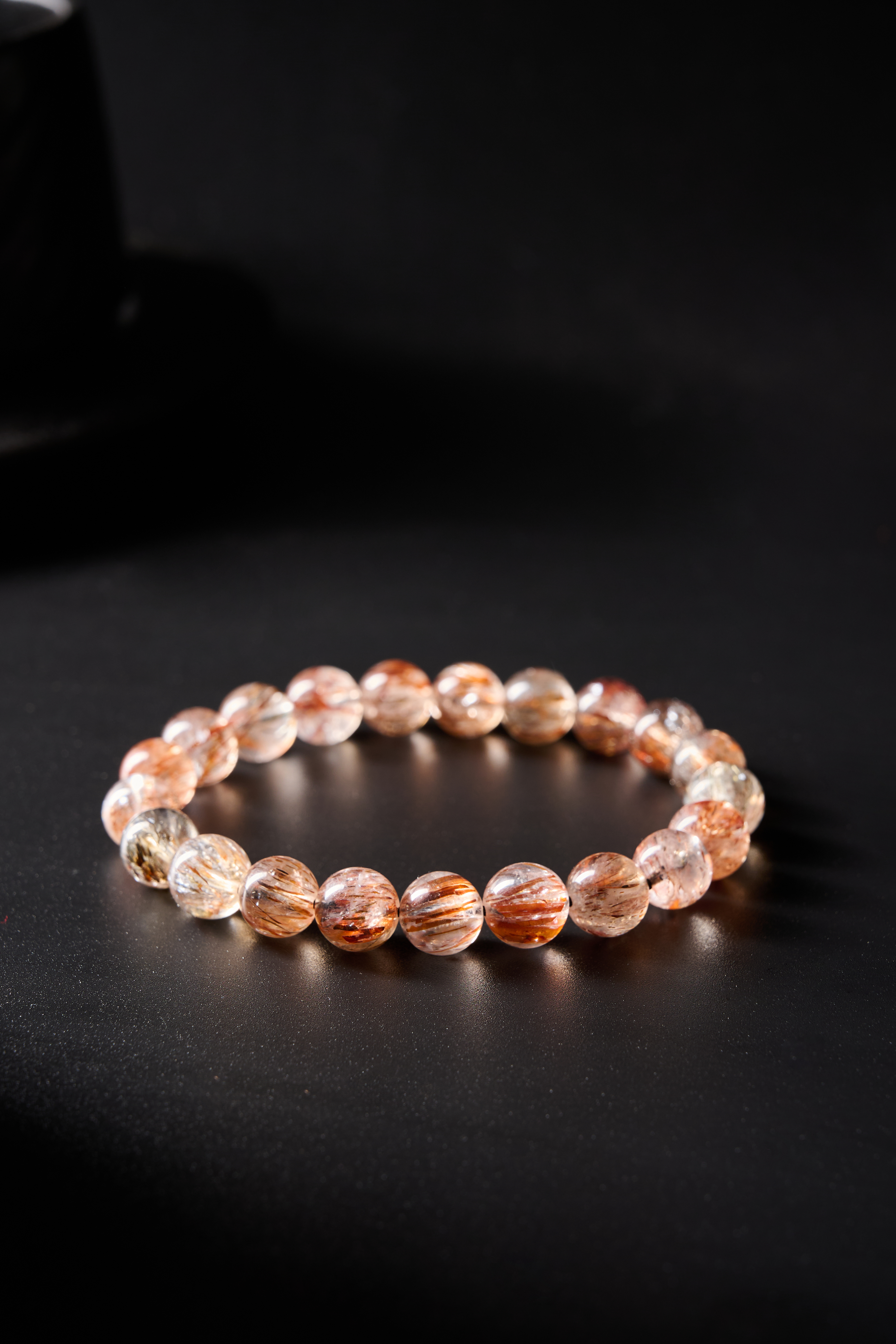 AvigJewelry rutilated quartz handcrafted bracelet, elastic 16–18 cm — full flat-lay top view