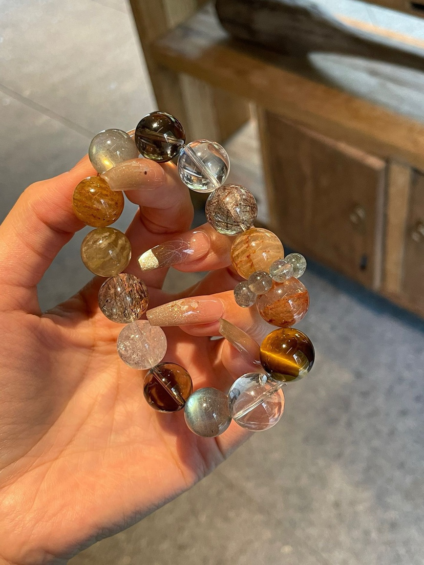 Close-up of Tiger’s Eye, Clear Quartz, and Black Rutilated Quartz beads