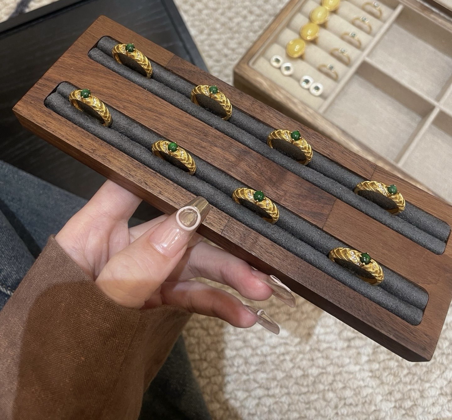 Display tray of multiple jade rings arranged in wooden holder