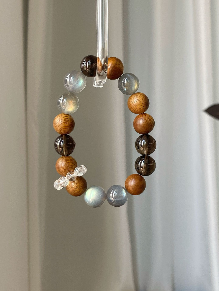 Lifestyle shot – bracelet paired with neutral tones for a calm aesthetic.