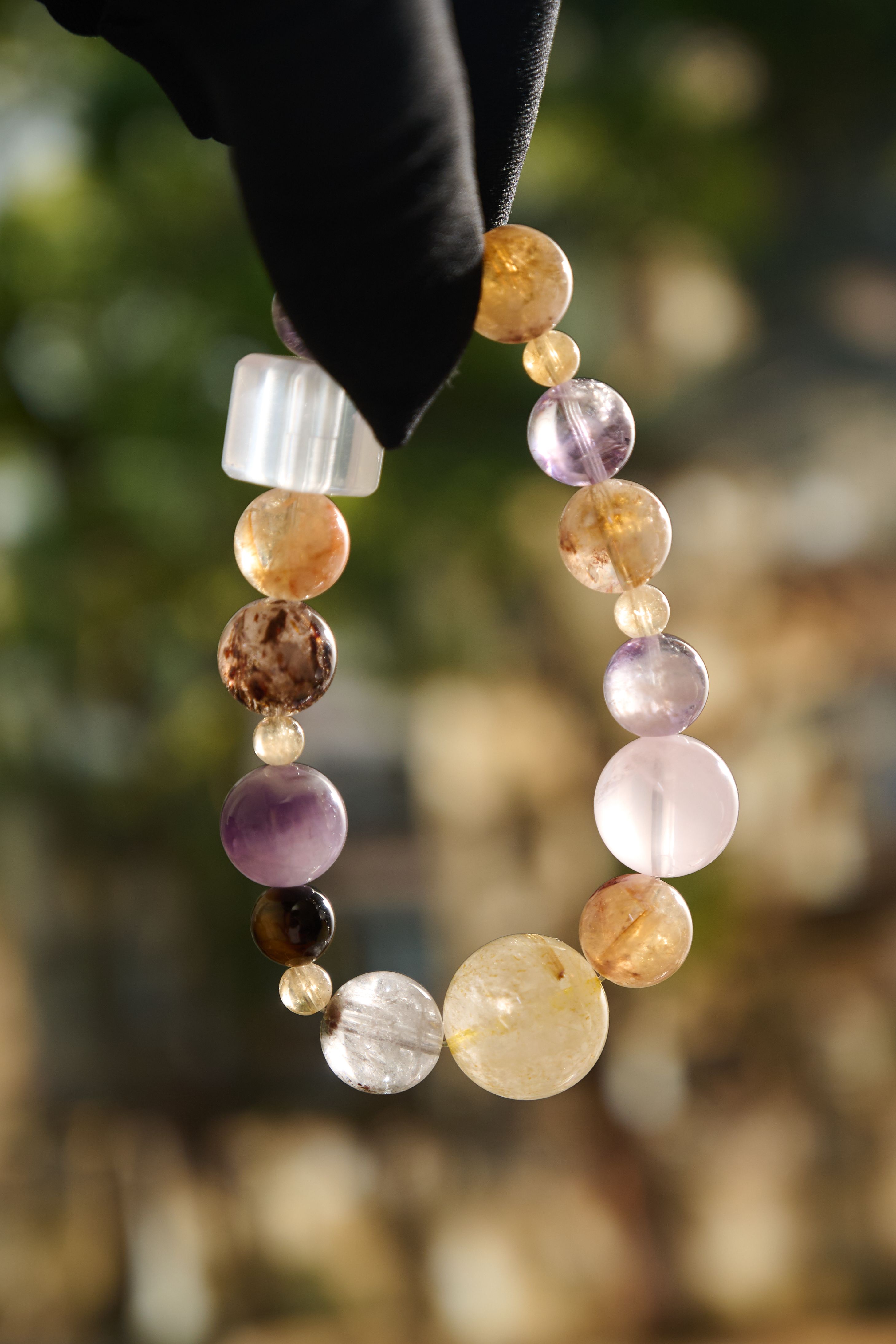Wrist-on shot – multi-crystal bracelet worn on hand, versatile styling, elegant shine.