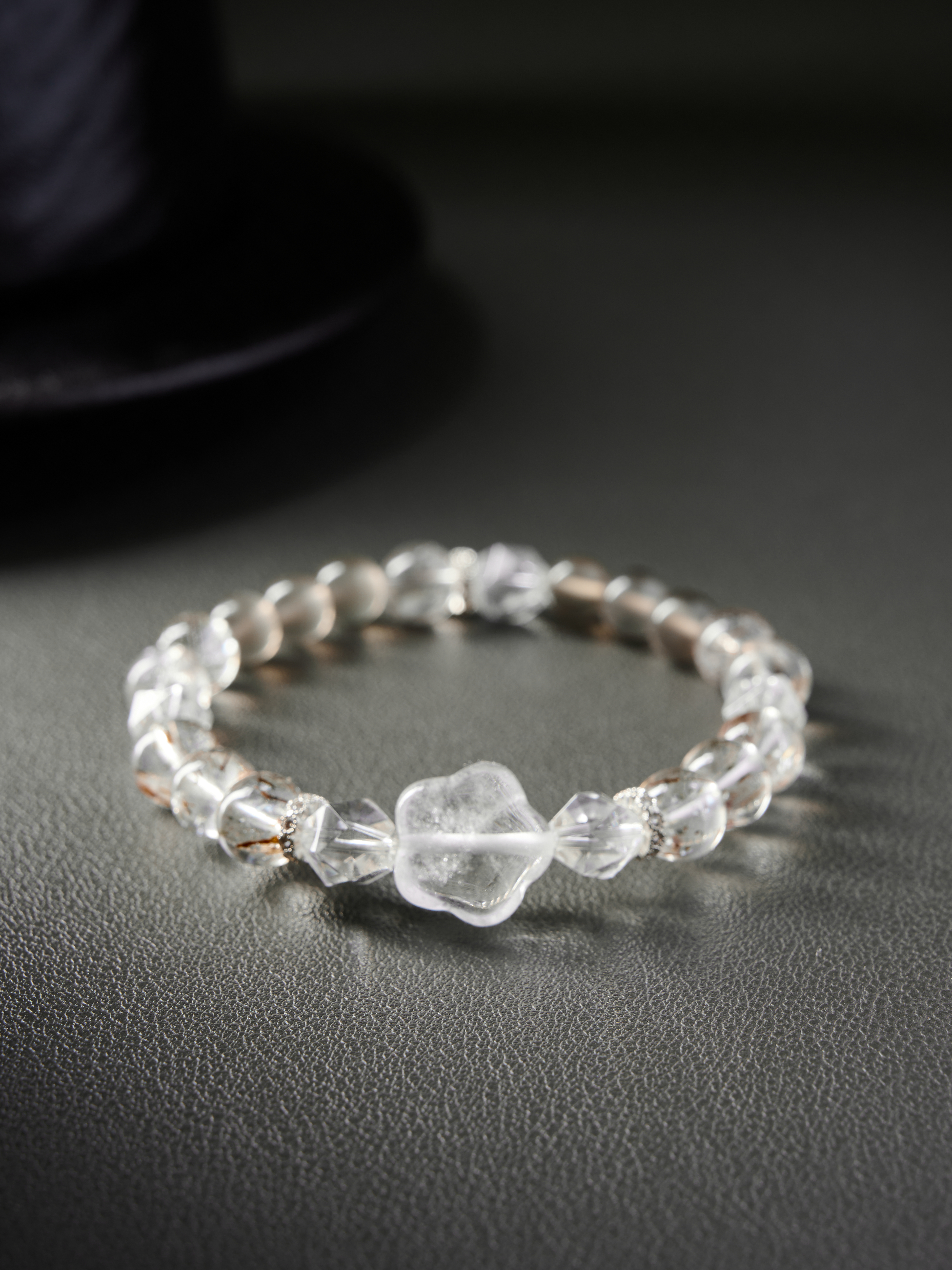 Top view with center clear-quartz nugget and silver spacers, even bead sequence