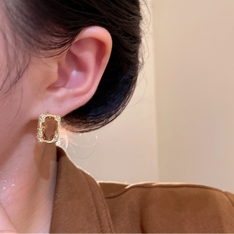 Gold rectangular rhinestone stud earrings worn on model E6818