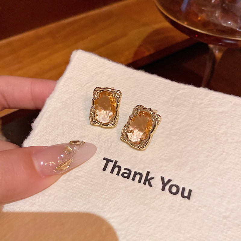 Gold rectangular rhinestone earrings close-up display E6818