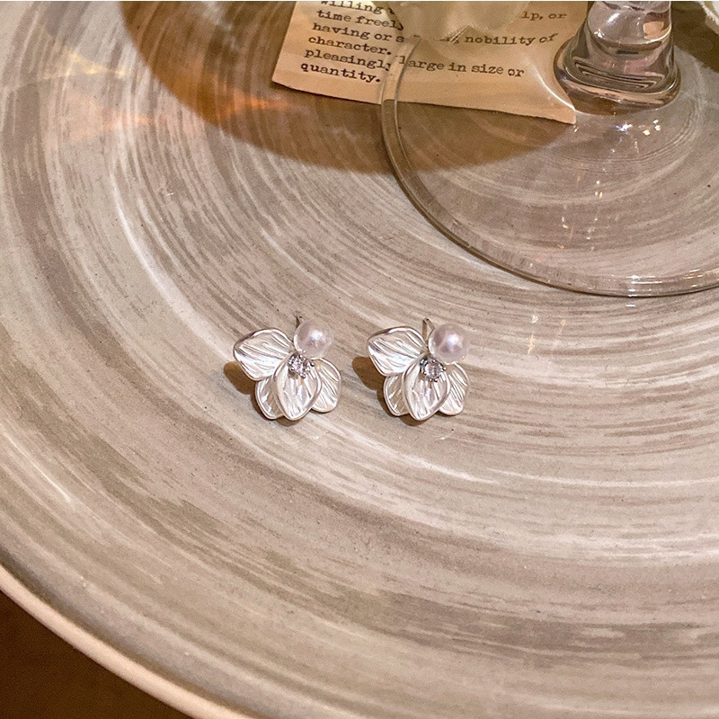 Silver flower pearl earrings product display