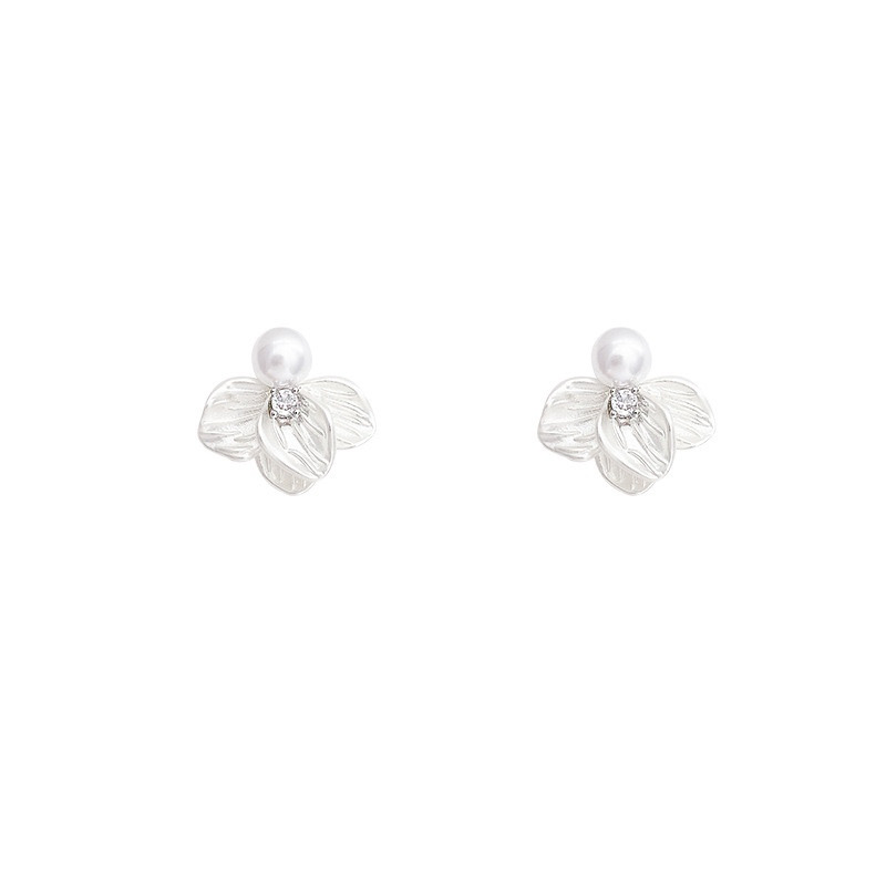 Silver pearl floral stud earrings on white background