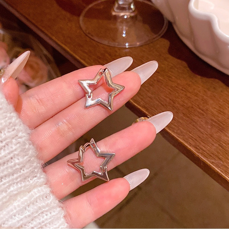 Silver star hoop earrings pair close-up