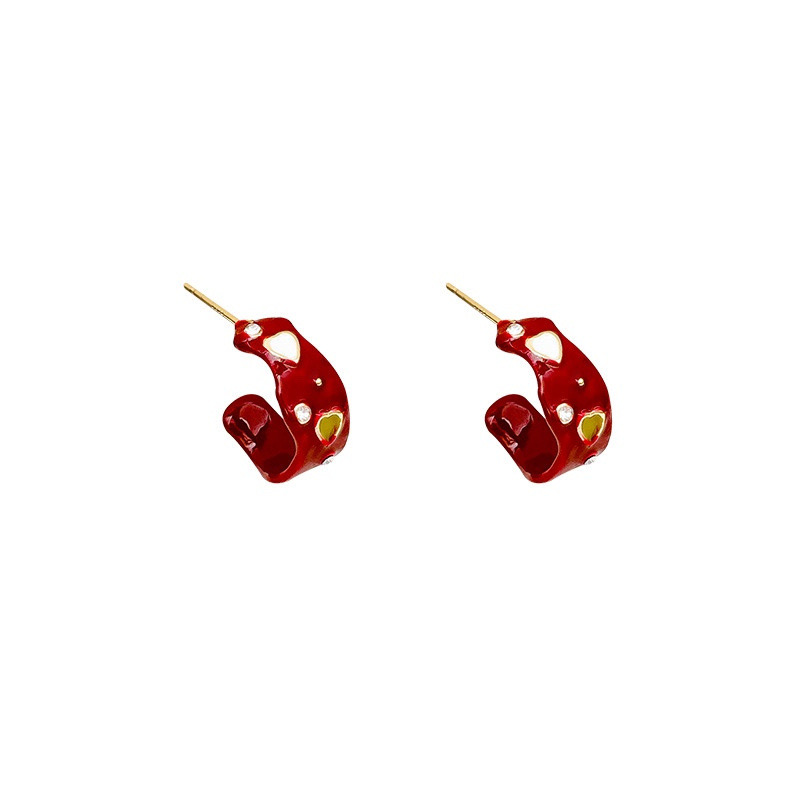 Red heart rhinestone hoop earrings on white background