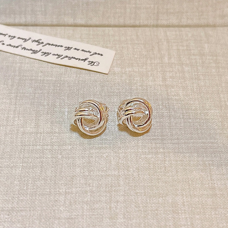 Silver knot stud earrings close-up