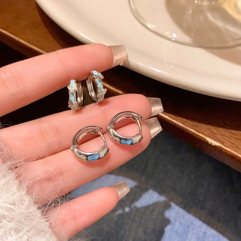Silver blue butterfly hoop earrings close-up