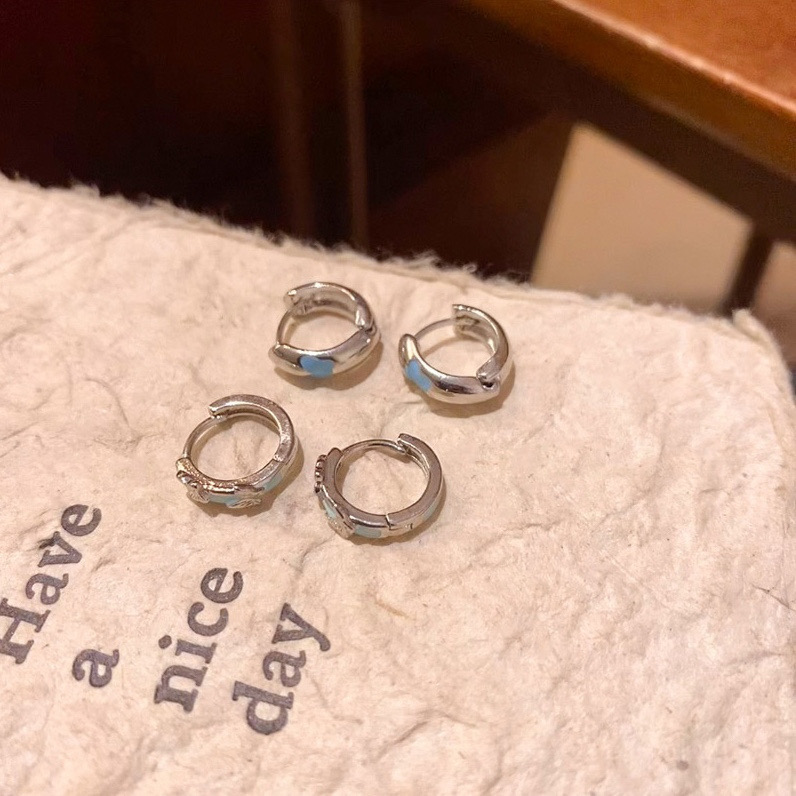 Silver butterfly hoop earrings product display