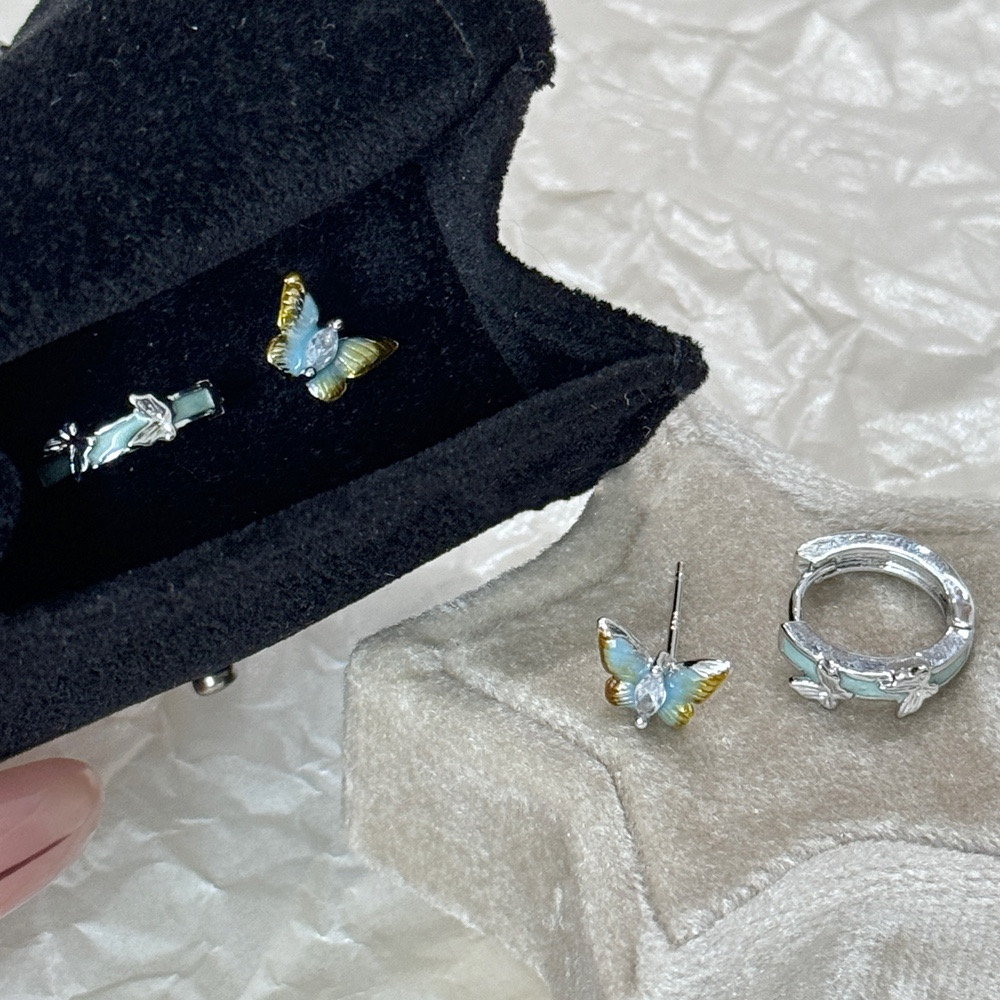 Small butterfly hoop earrings worn on ear