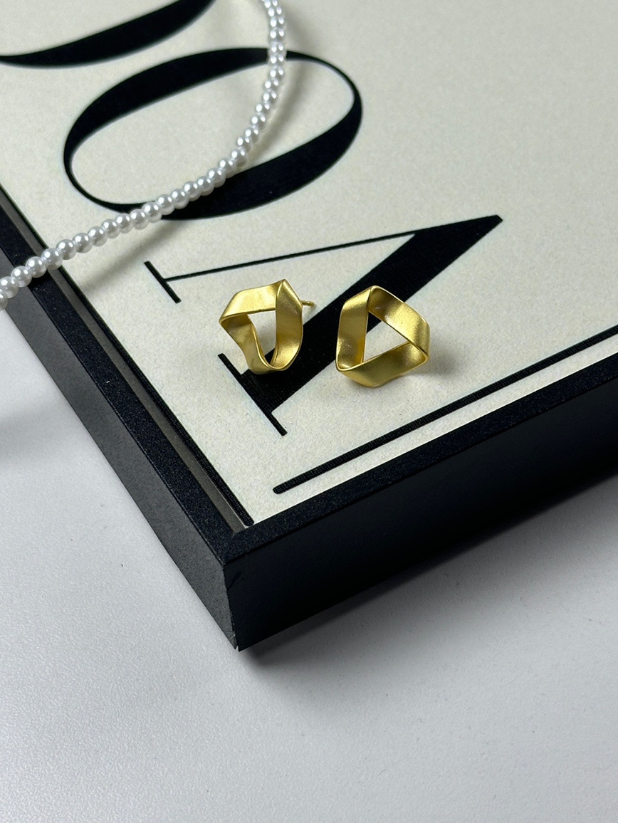 Gold geometric earrings product display