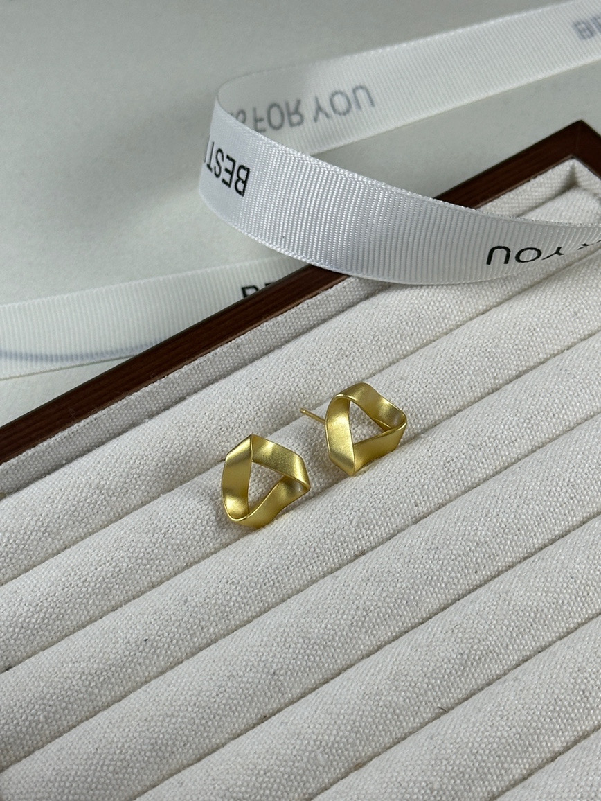 Gold geometric earrings side view