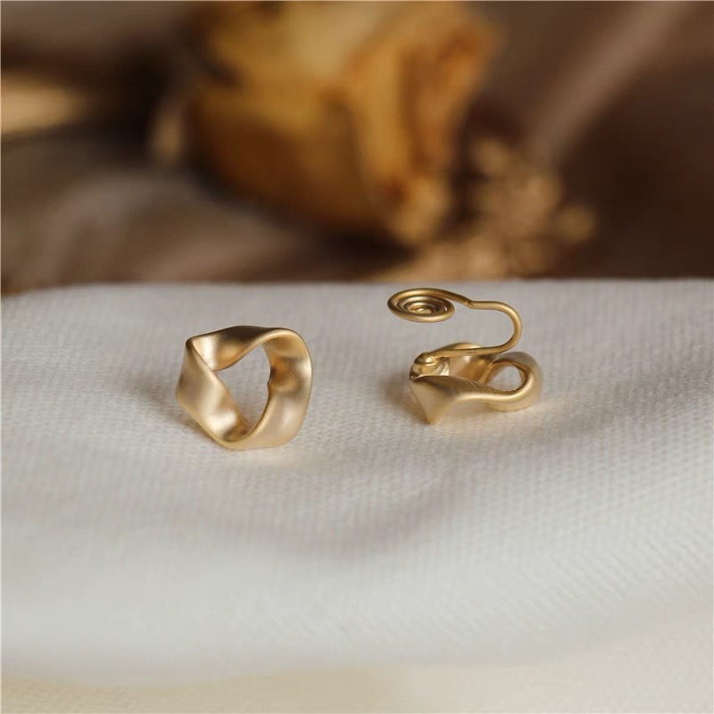 Gold earrings front and back closure detail