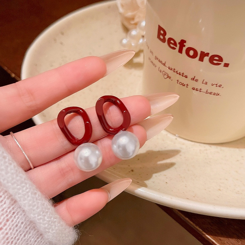 Burgundy pearl drop earrings lifestyle view