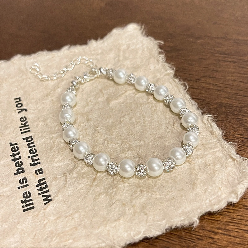 Elegant White Pearl Bracelet with Sparkling Bead Details