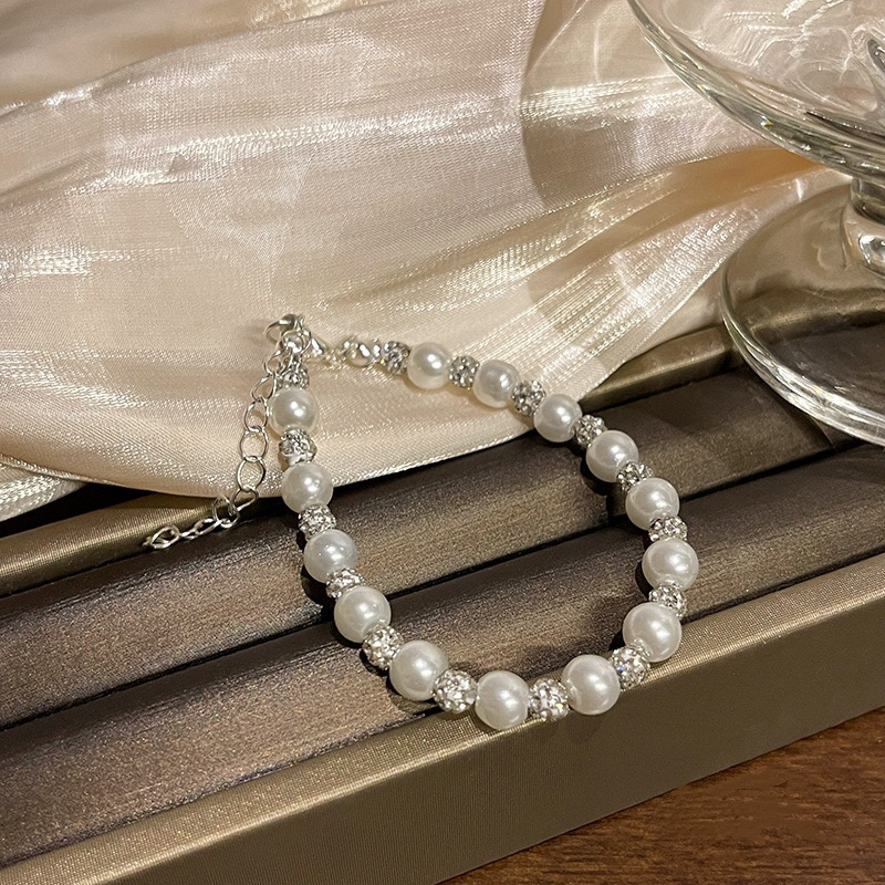  White Faux Pearl Bracelet with Sparkling Silver Tone Details