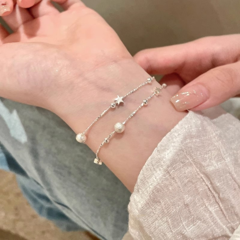 Silver Double Strand Star Beaded Bracelet Worn on Wrist