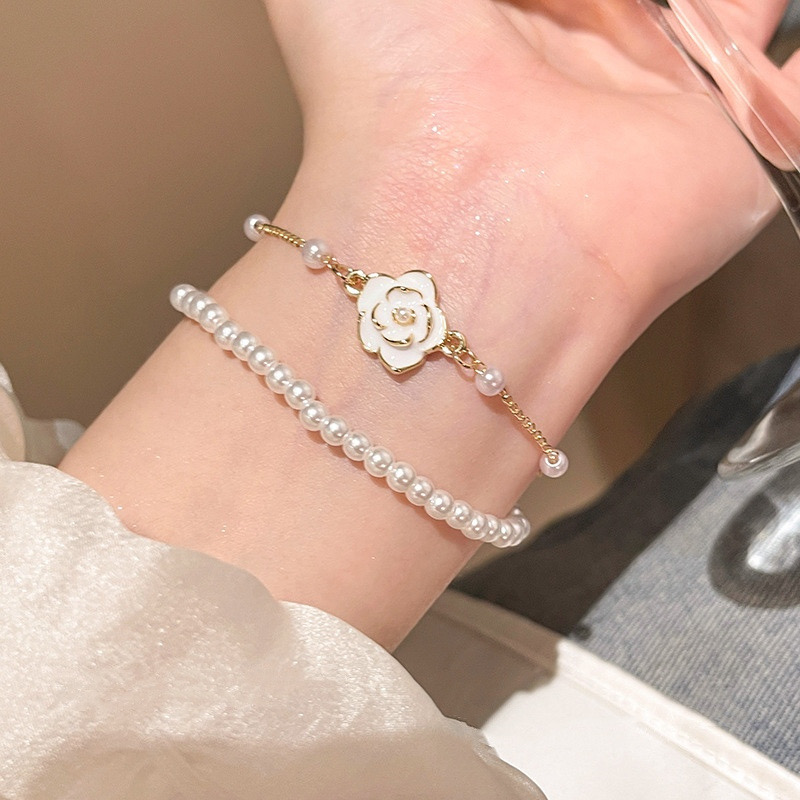 White Faux Pearl Floral Double Layer Bracelet on Wrist