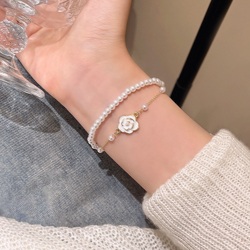 White Floral Faux Pearl Bracelet Wrist View
