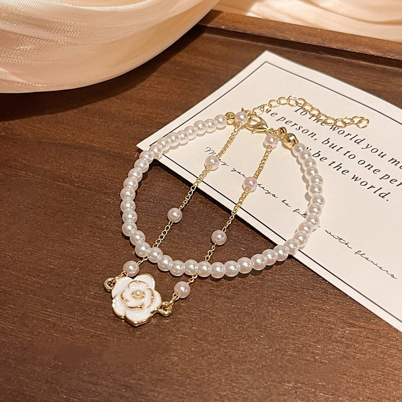 White Faux Pearl Floral Layered Bracelet Flat Lay
