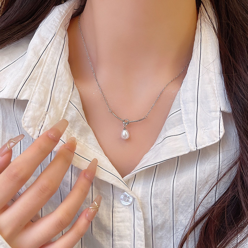 Silver Teardrop Pearl Look Necklace Styled with Striped Shirt