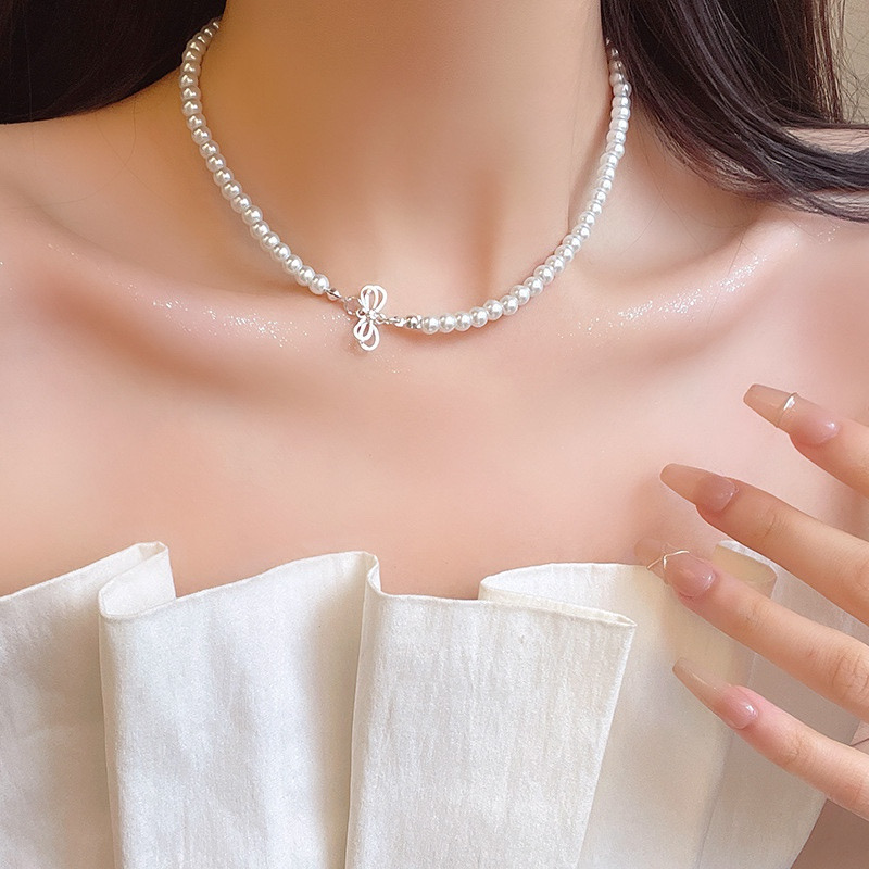 Silver Tone Bow Faux Pearl Choker Necklace Close Up on Model