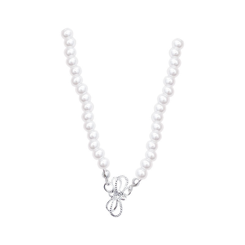 White Faux Pearl Bow Choker Necklace with Silver Tone Bow Charm on White Background