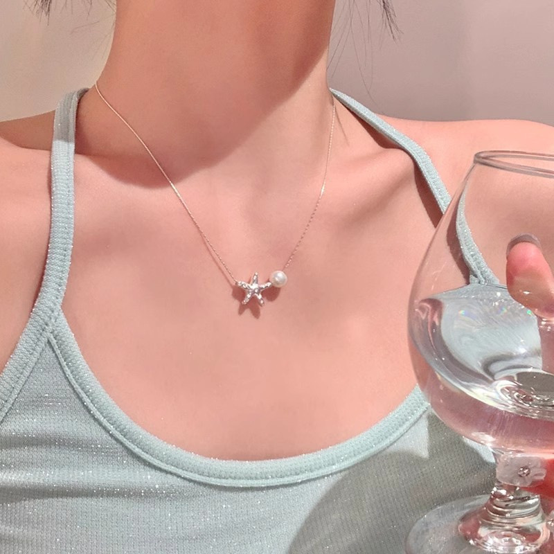 Silver Starfish Faux Pearl Necklace Styled with Light Green Casual Outfit