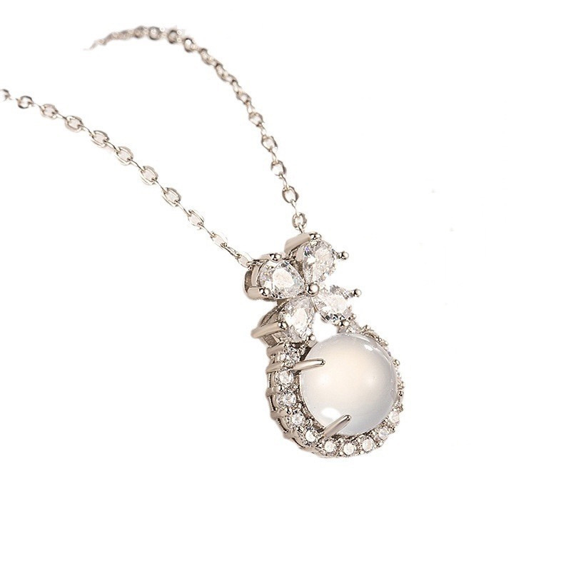 Silver Floral White Stone Pendant Necklace with Sparkling Accents on White Background