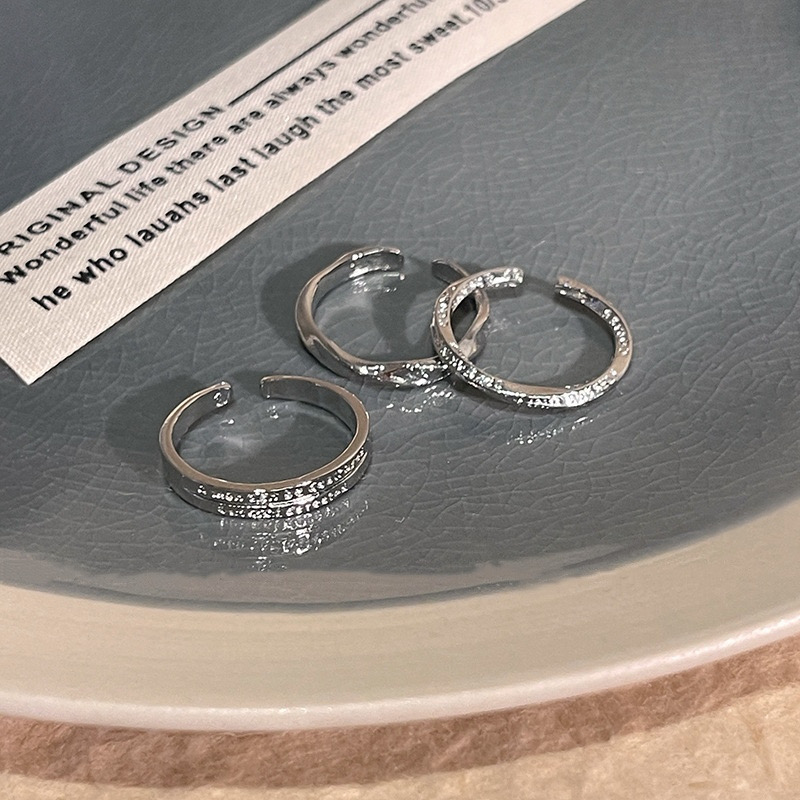 Three Textured Silver Adjustable Rings on Tray