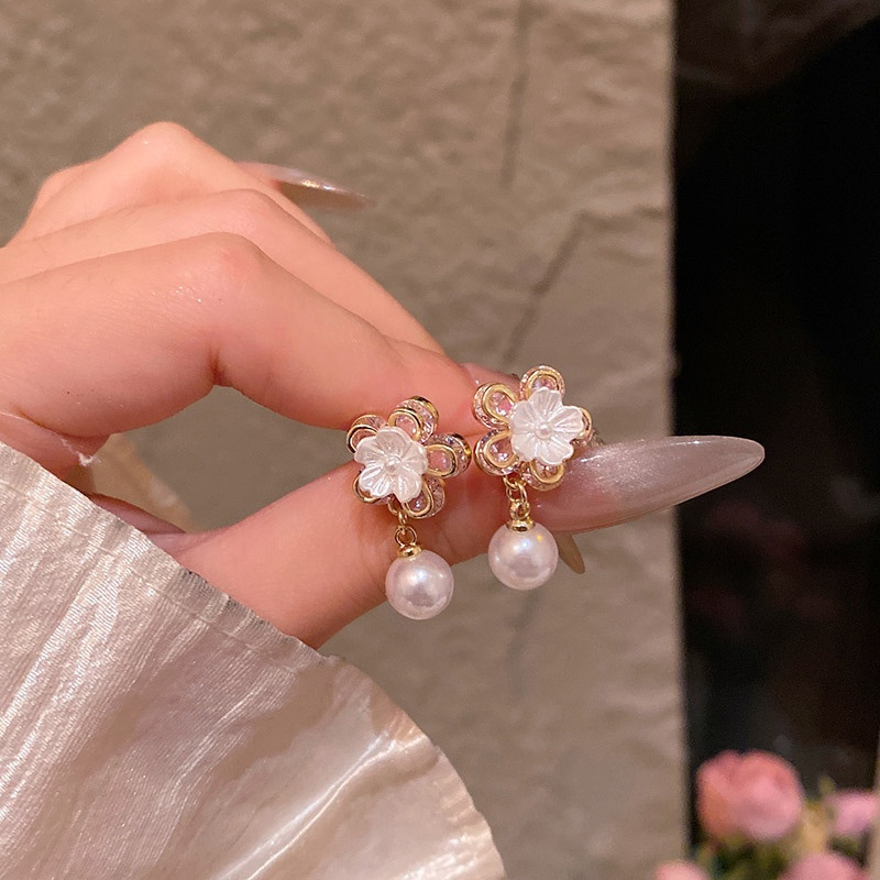 Gold flower earrings with dangling faux pearls