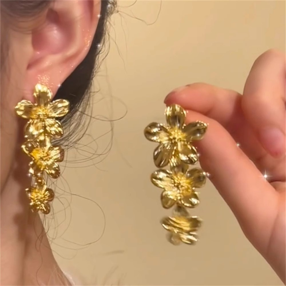 Gold Triple Flower Drop Earrings on Model