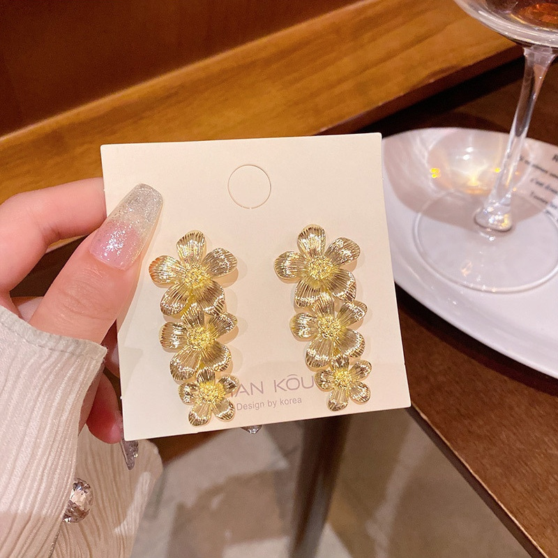 Gold Triple Flower Drop Earrings on Display Card
