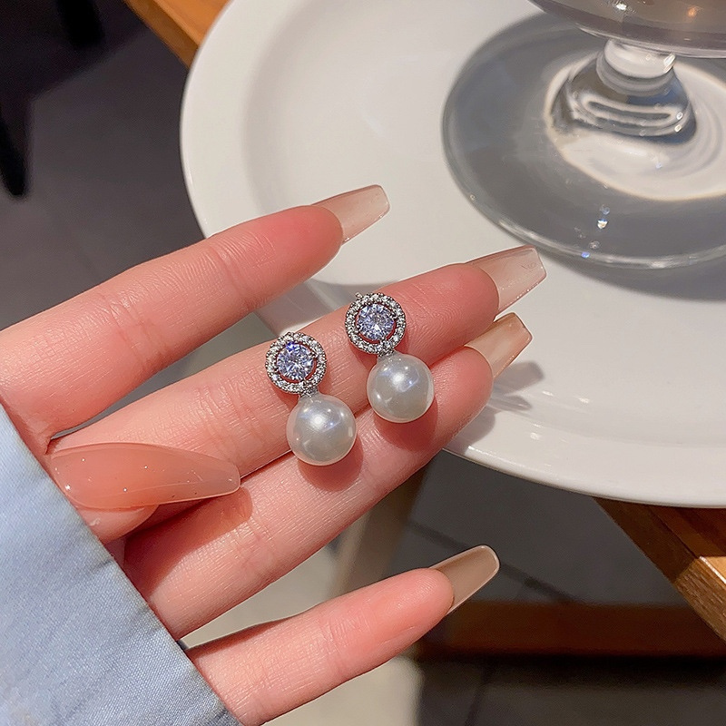 Silver Pearl Drop Earrings Handheld Close Up