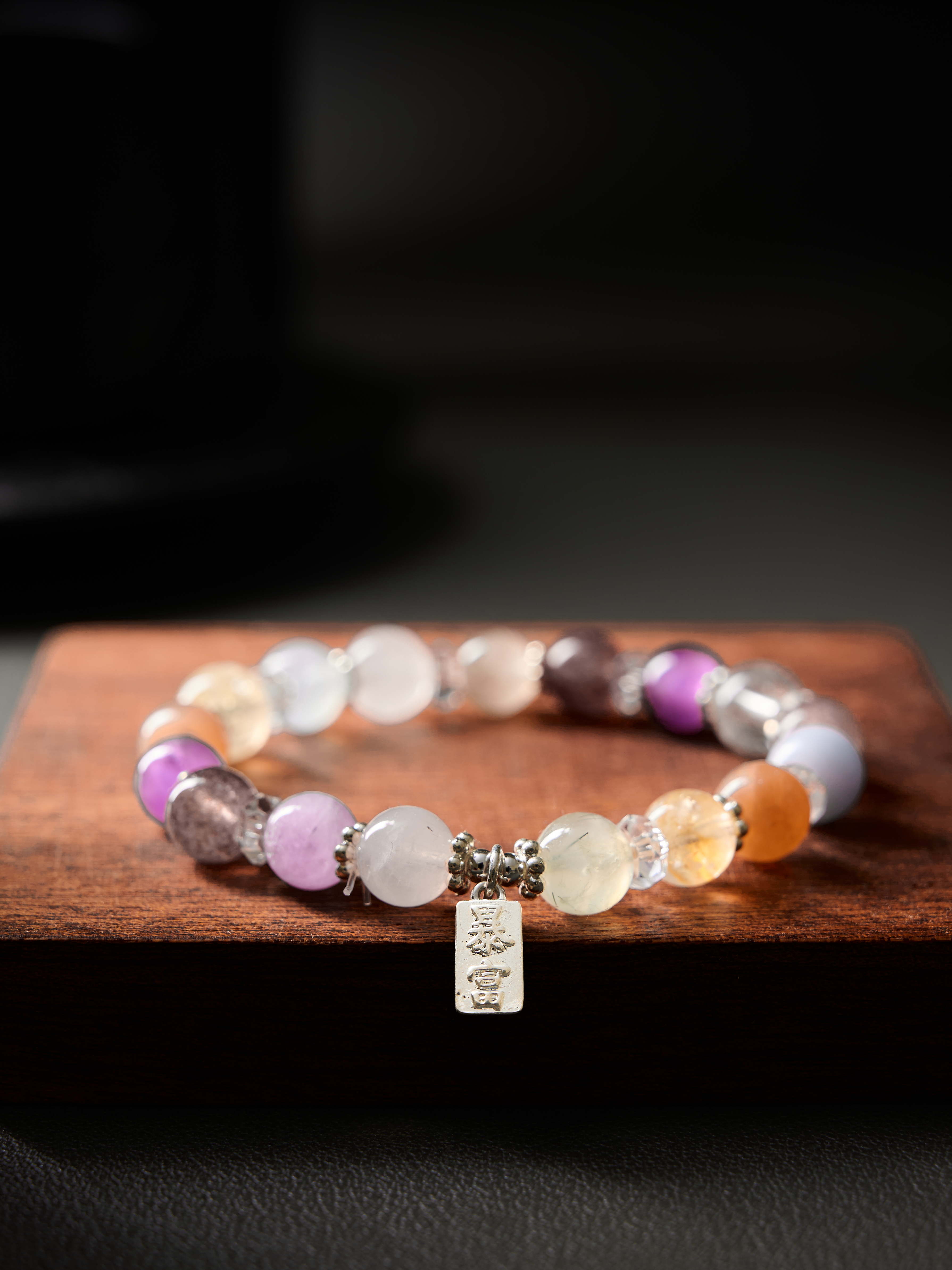 Top view with balanced bead sequence and faceted clear-quartz separators, hand-strung elastic cord
