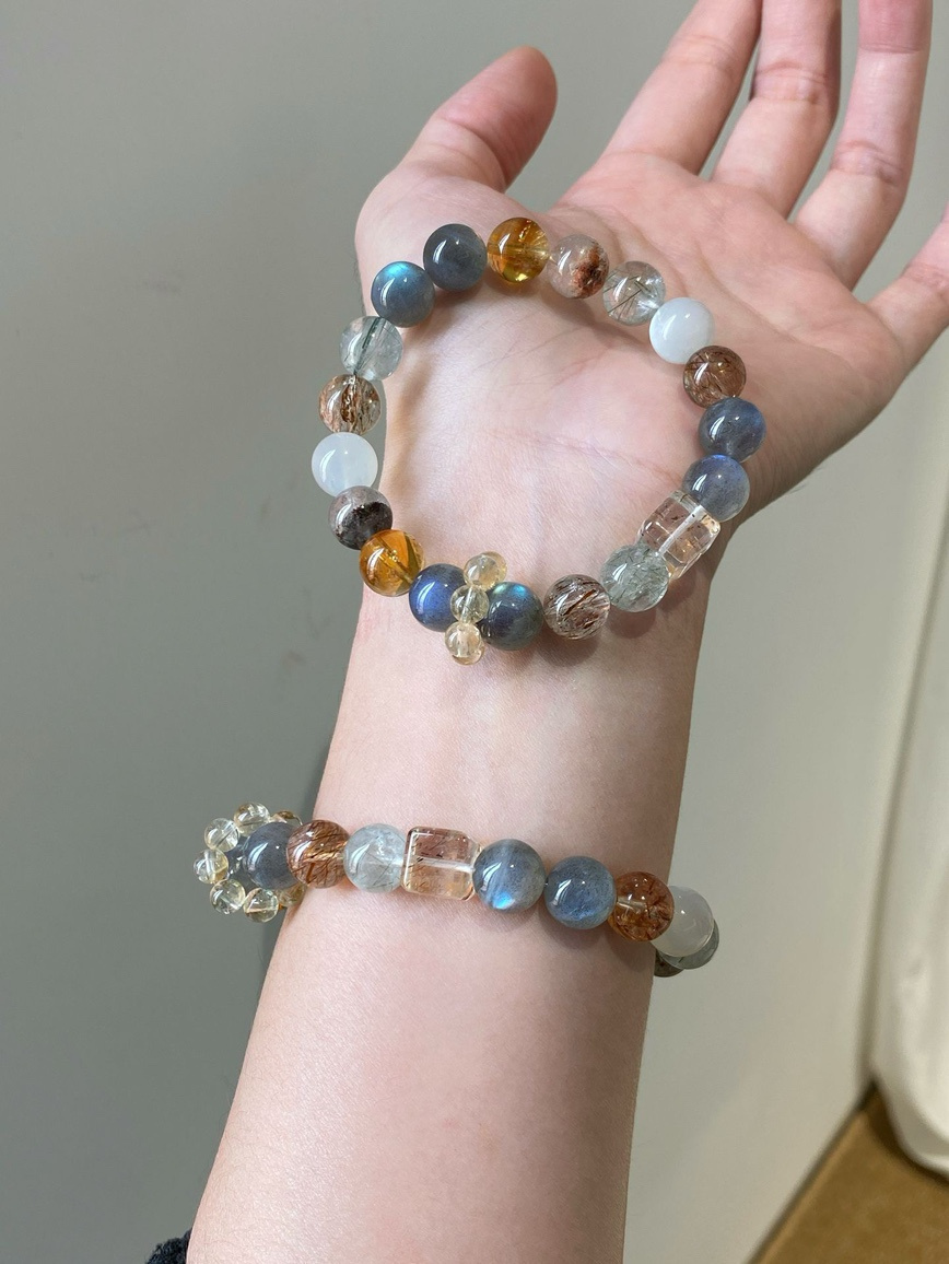 Lifestyle photo – bracelet worn on wrist showing soft glow of mixed crystals.