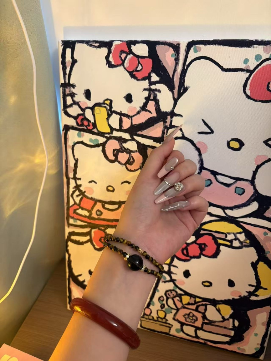 Obsidian and Tiger’s Eye energy bracelet styled with modern nails and art background