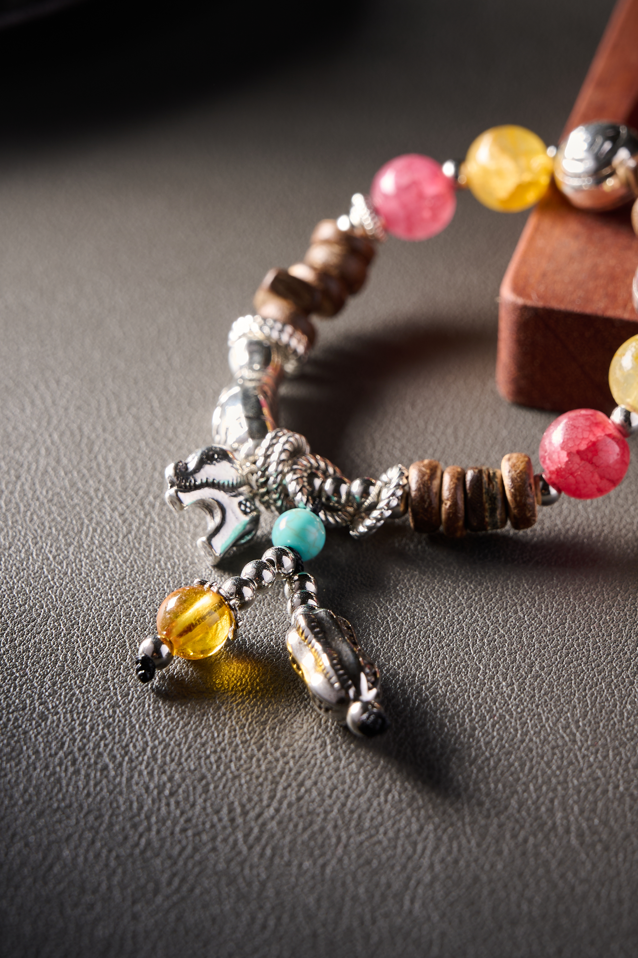 Close-up – polished wooden beads with vintage alloy spacers, warm earthy texture.
