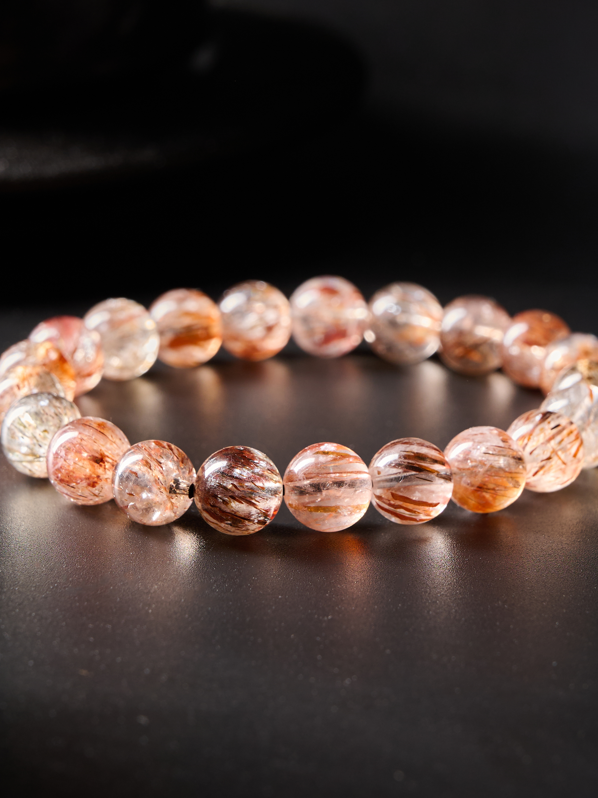 Macro of knot/spacer area with adjacent beads, showcasing craftsmanship and elastic finish
