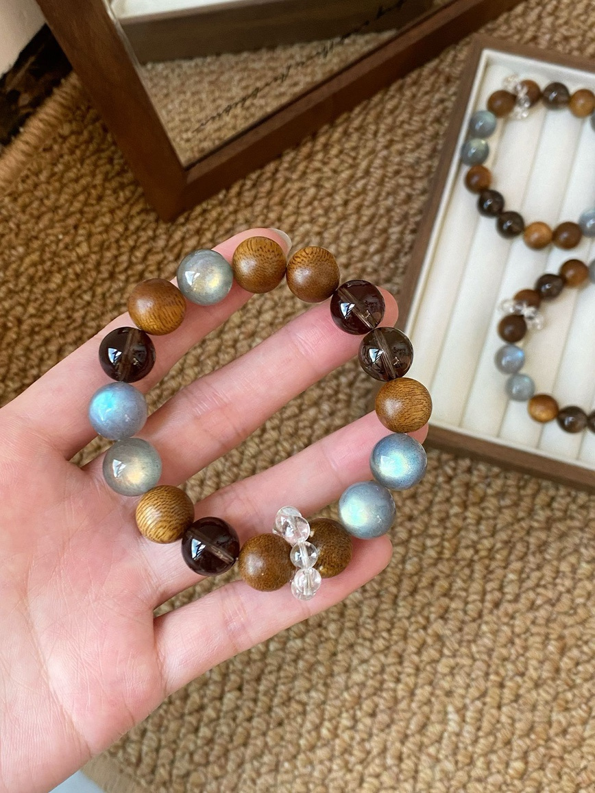 Close-up – detailed shot of natural wood and crystal bead texture.