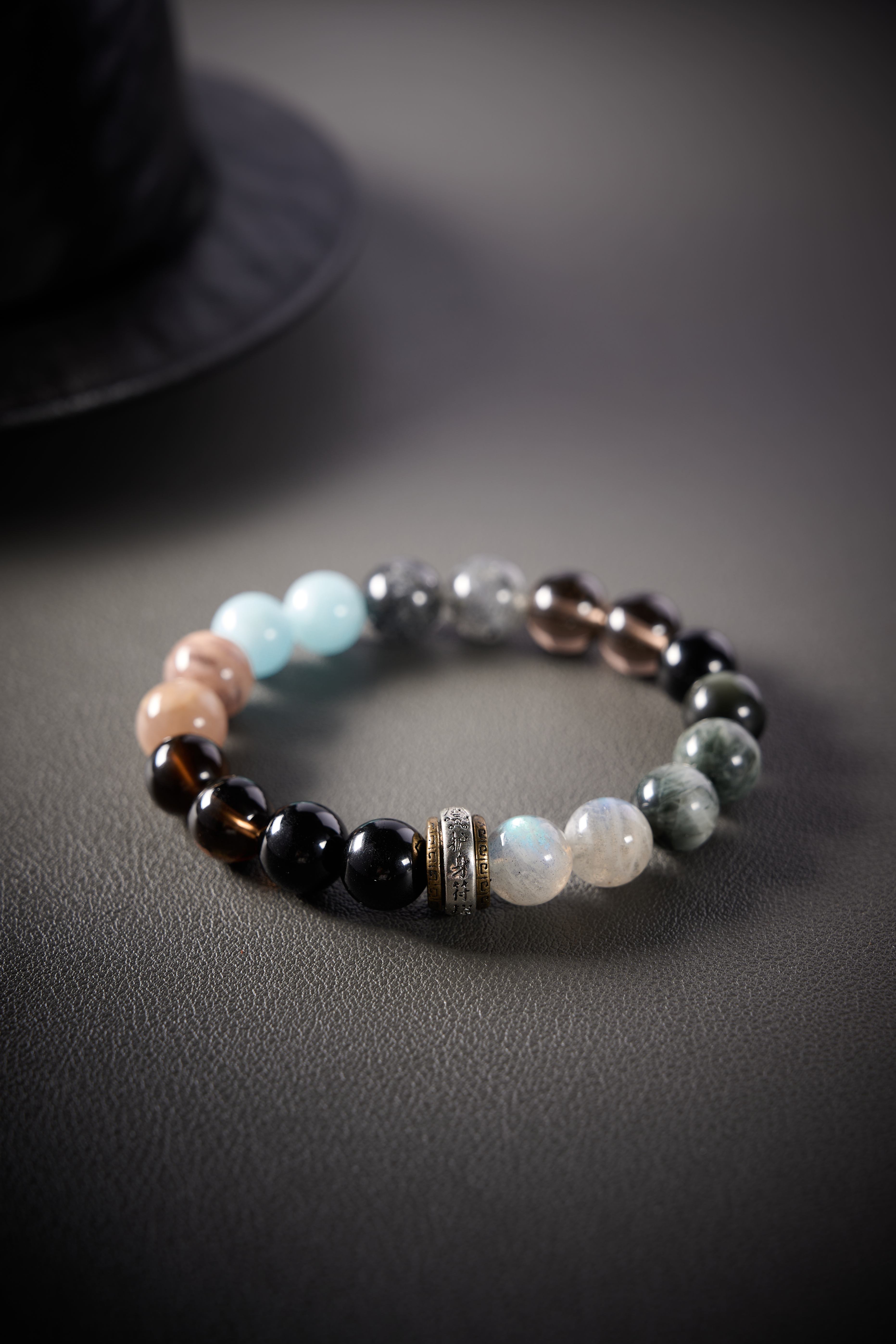 Close-up – moonstone bead with soft glow and subtle sheen, gentle iridescence visible.