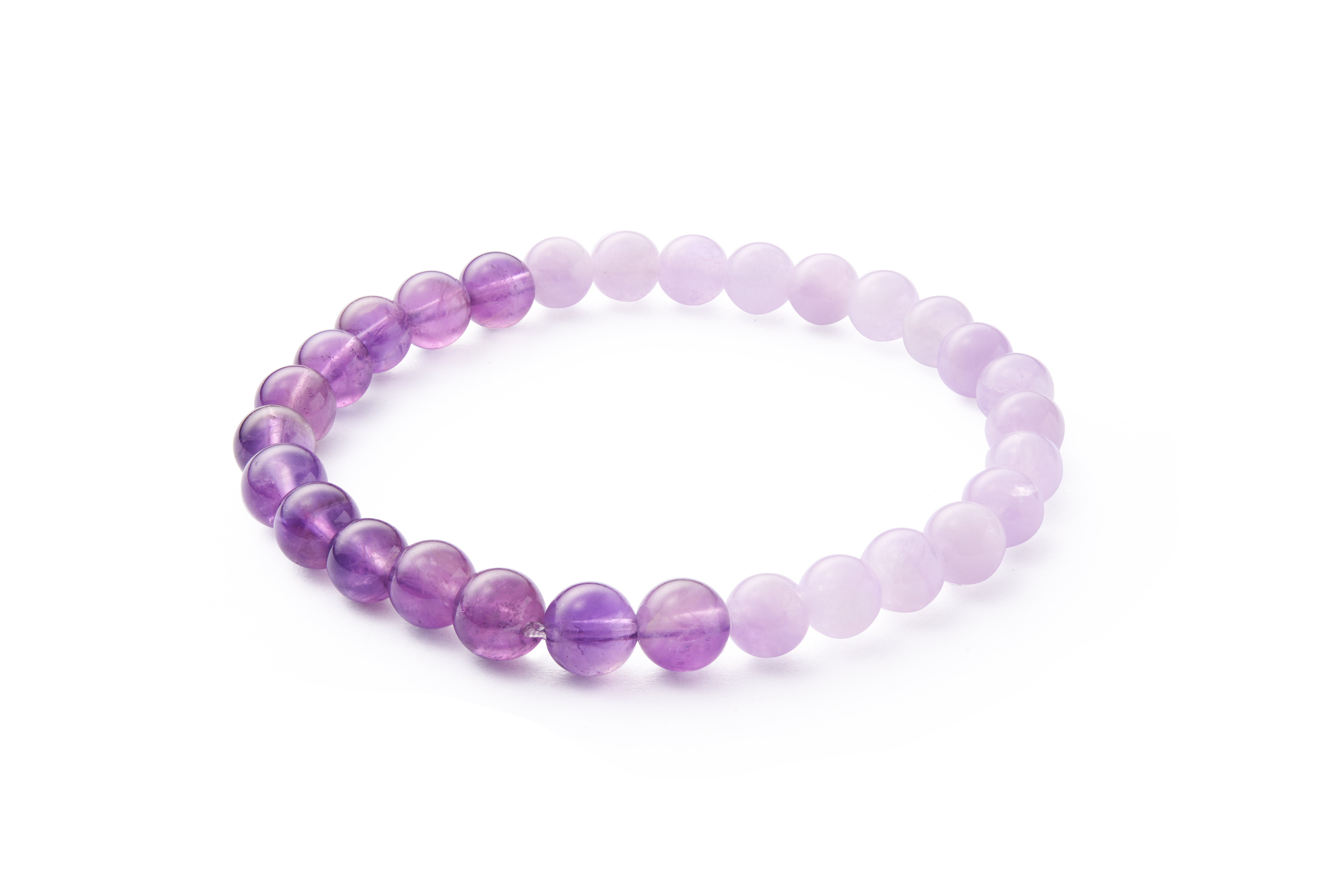 Minimal flat composition highlighting smooth round beads and even spacing, hand-strung elastic bracelet