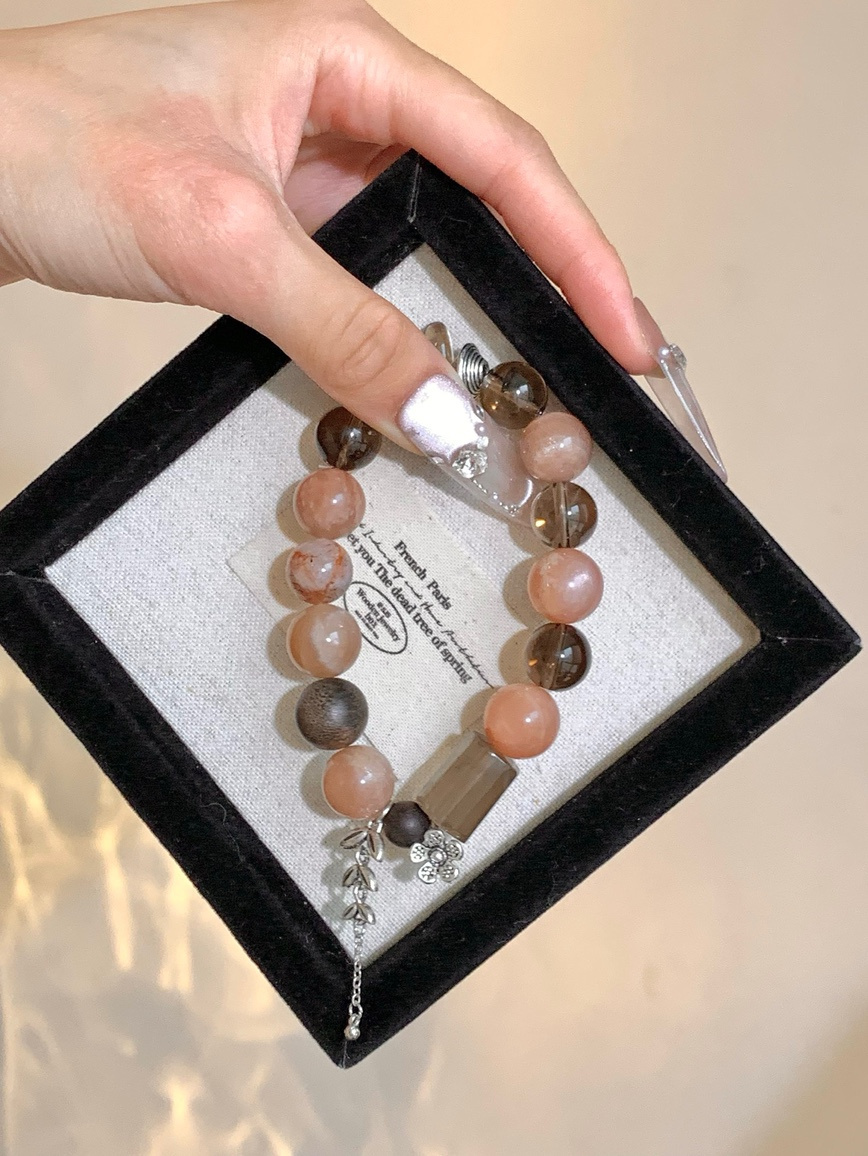 Bracelet displayed in black velvet jewelry box with soft lighting