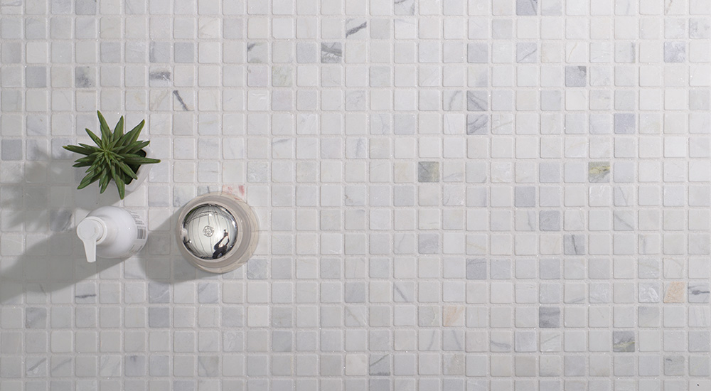 {"default":"Polished 1 inch marble tiles in a square grid for modern kitchen backsplash."}
