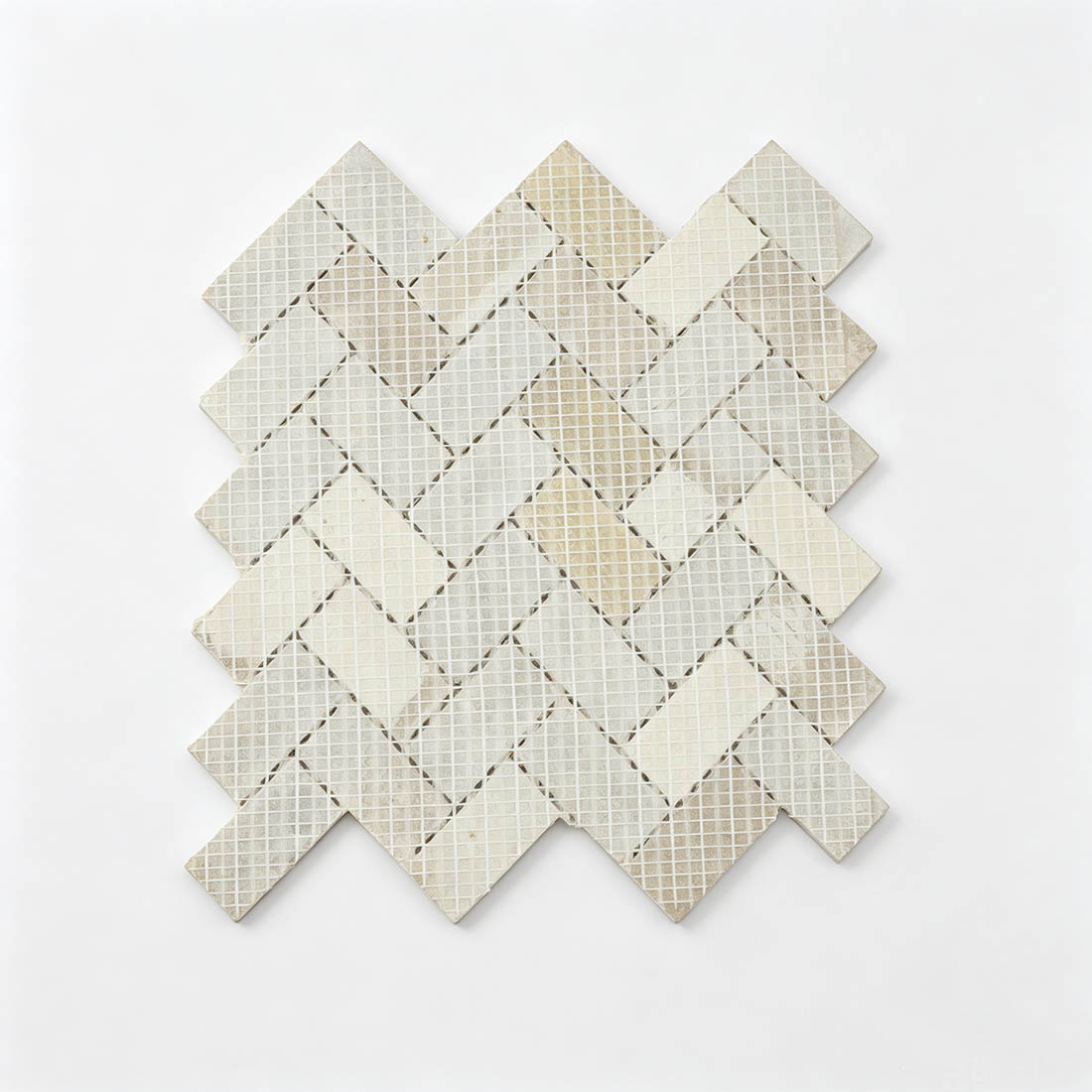 Mesh backing of beige marble herringbone mosaic tile sheet
