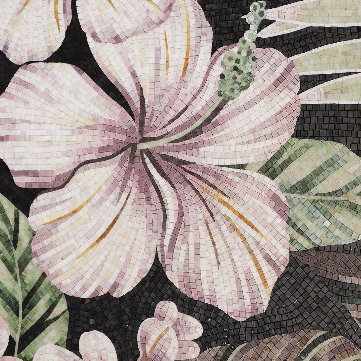Close-up of a pink hibiscus flower mosaic with green leaves on a black background.