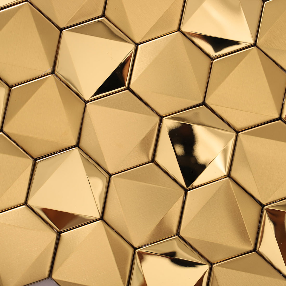 Detailed texture of 3D gold hexagon mosaic tiles with reflective facets.