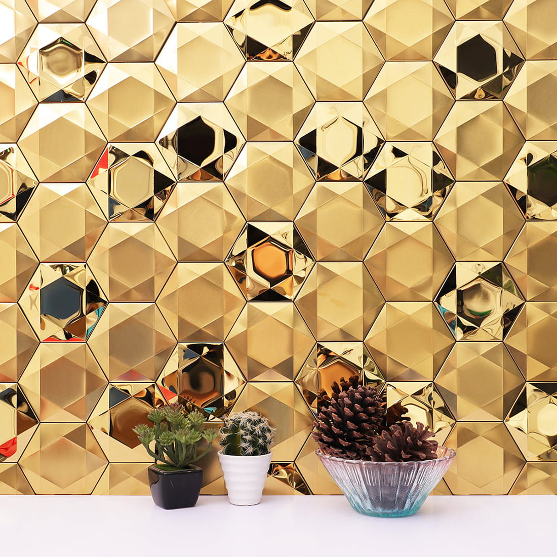 Interior wall decorated with 3D gold hexagon stainless steel mosaic tiles.